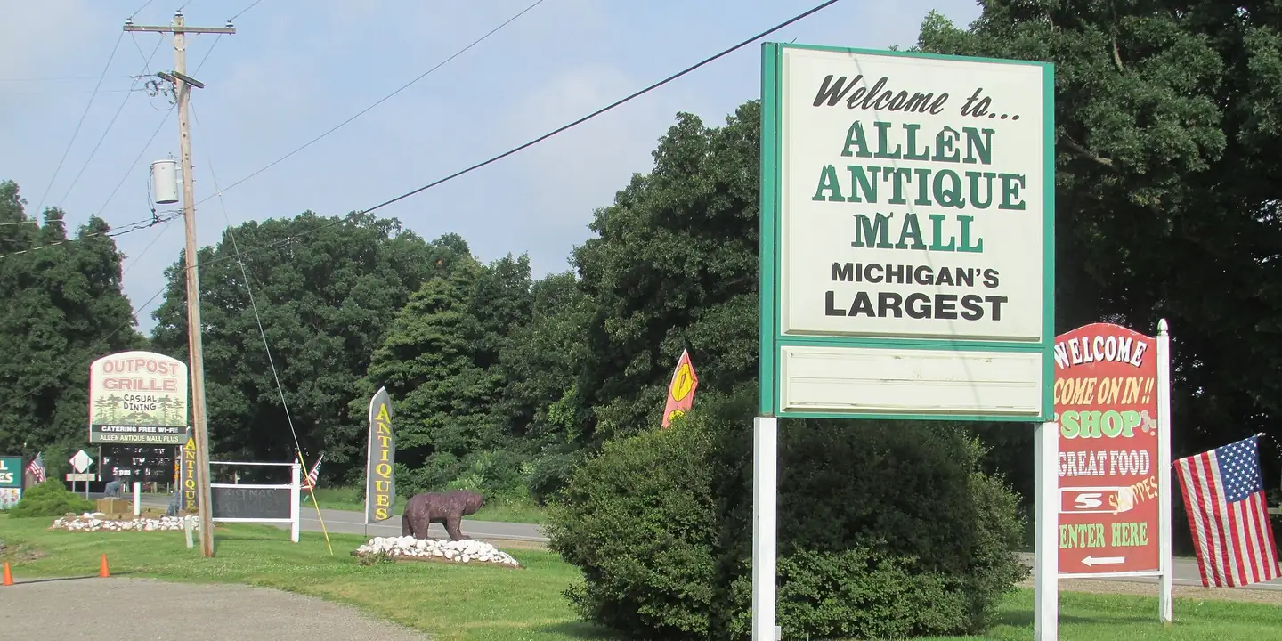 Roadside sign for an antique mall calling itself Michigan's largest