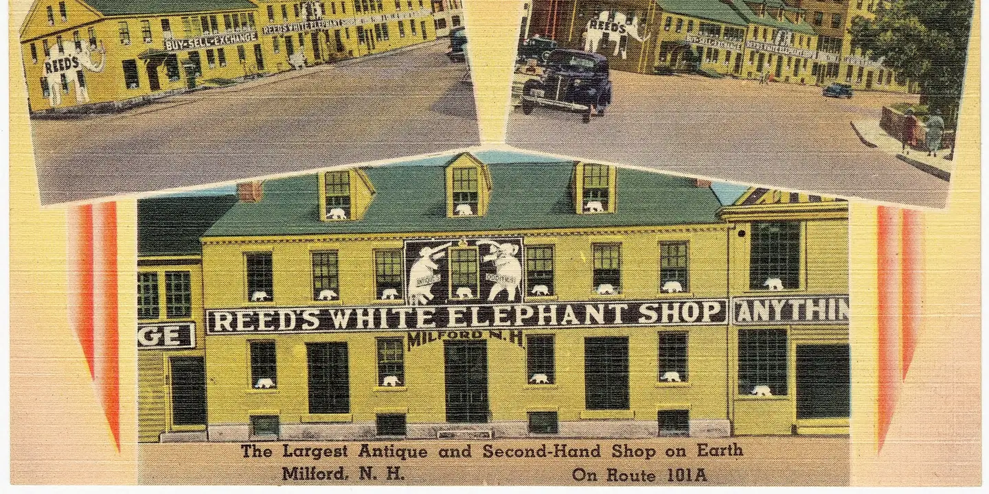 Vintage linen postcard of a large yellow antique and second-hand shop