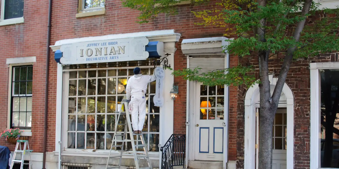 Brick shopfront with large windows on a city street